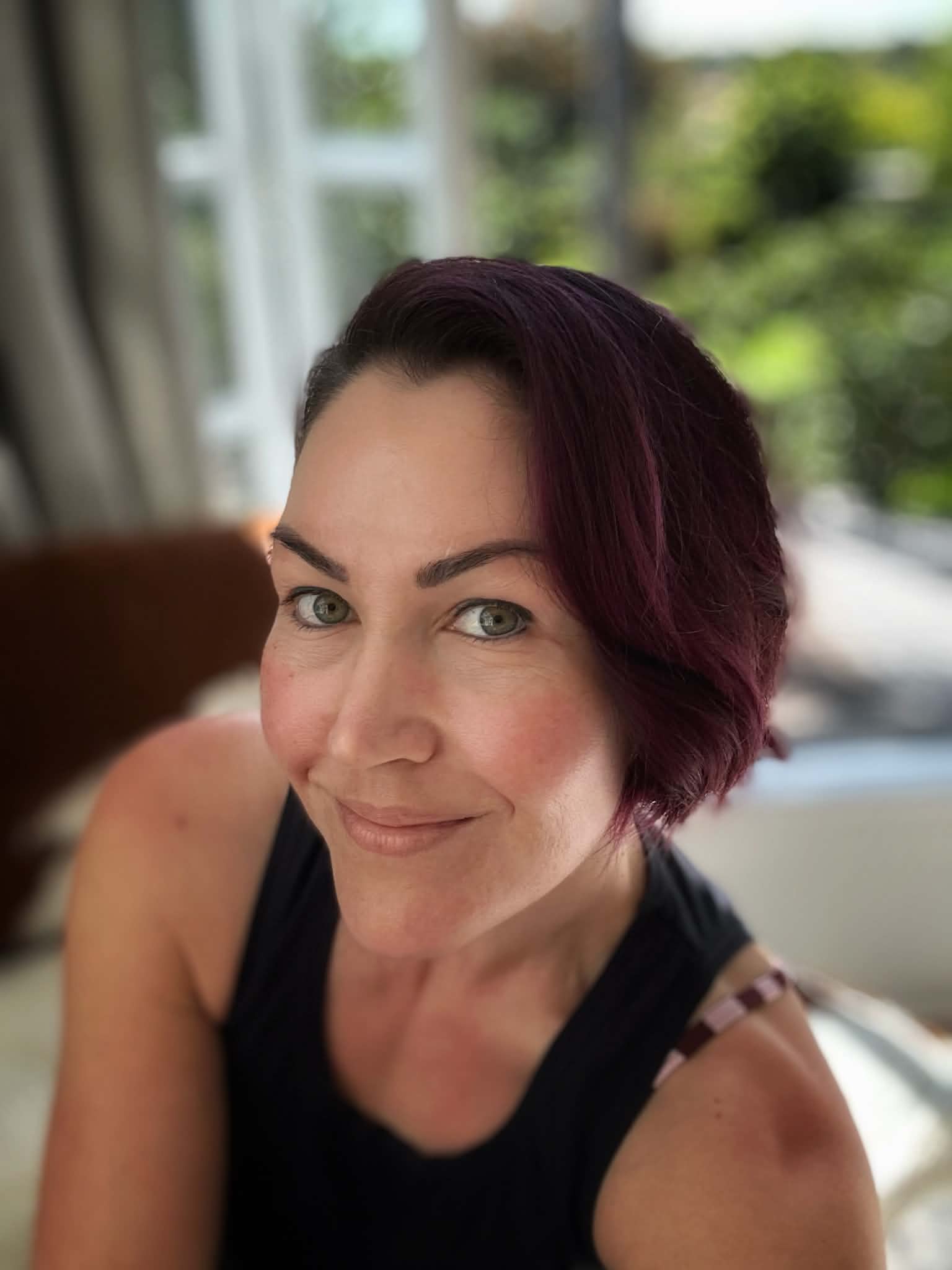 Cheryleita smiling wearing a black tank top