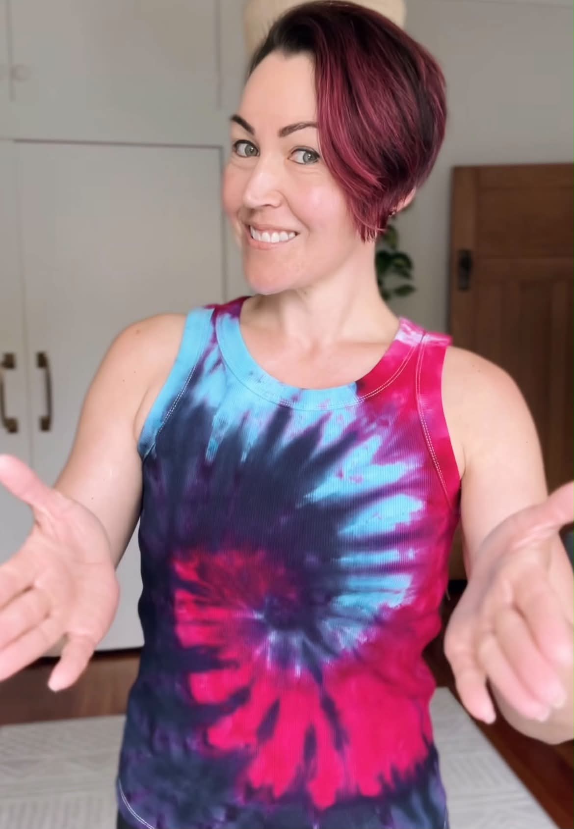 Cheryleita smiling wearing a colourful tank top